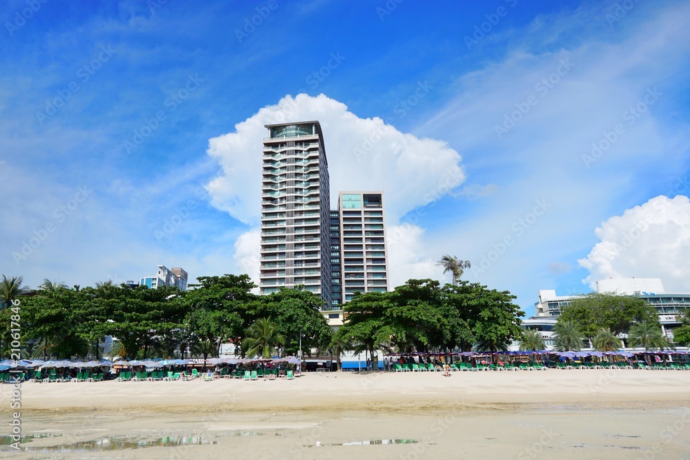 PATTAYA, THAILAND - MAY 19, 2018 : Pattaya beach and city with blue sky and cloud in the evening, Many tourists visit here. View for seascape. Space for text in template. Travel concept. PATTAYA, THAILAND - MAY 19, 2018 : Pattaya beach and city with blue sky and cloud in the evening, Many tourists visit here. View for seascape. Space for text in template. Travel concept.