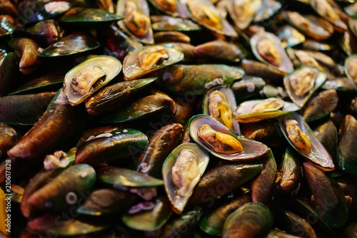 Too soft, fresh mussels  in the market at Thailand. Green mussels abstract background. vintage.