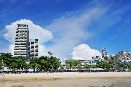 PATTAYA, THAILAND - MAY 19, 2018 : Pattaya beach and city with blue sky and cloud in the evening, Many tourists visit here. View for seascape. Space for text in template. Travel concept. © Dark Caramel