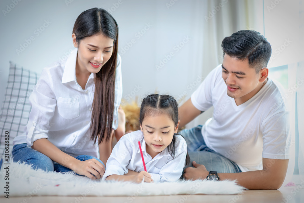 Young family drawing together with colorful pencils at home,Asian kids and happy people concept.kid girl drawing with color pencils,Hand of asian child draw and paint with crayon in vintage color tone Young family drawing together with colorful pencils at home,Asian kids and happy people concept.kid girl drawing with color pencils,Hand of asian child draw and paint with crayon in vintage color tone