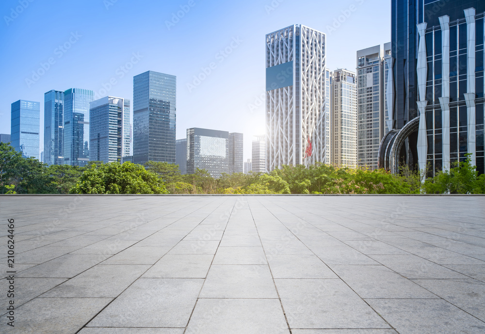 Urban skyscrapers with empty square floor tiles