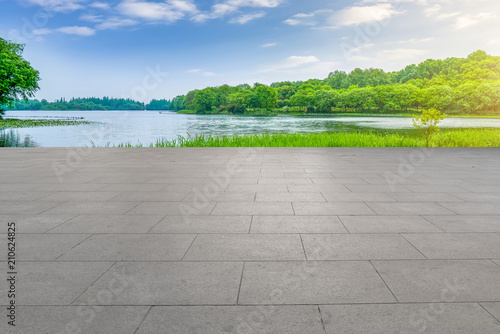 The empty asphalt road square and natural landscape in the setting sun