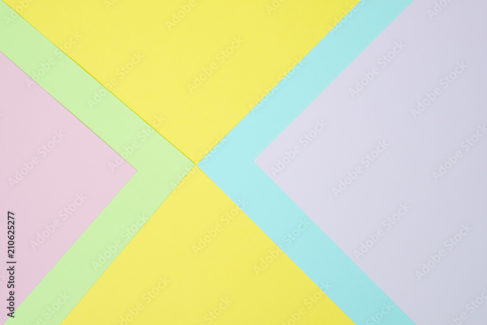 Pastel colored paper flat lay top view, background texture, pink, purple, yellow, beige, green and blue.