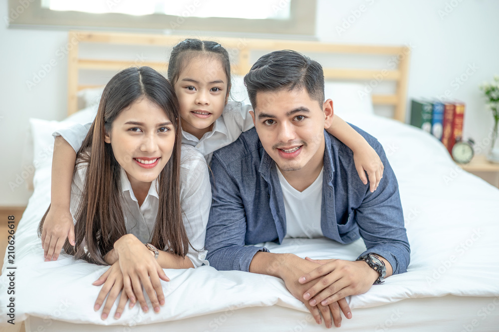A happy asian family with kids in the living. A happy asian family with kids in the living.