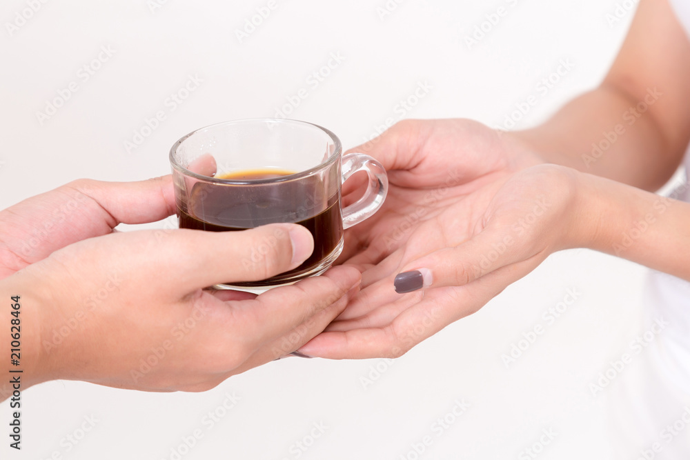 Close up of the arista giving cup of coffee to young asia woman. . Isolated on white background. Studio lighting. Concept for healthy. Close up of the arista giving cup of coffee to young asia woman. . Isolated on white background. Studio lighting. Concept for healthy.