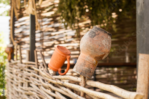 jug on a wooden fence © LubaKoba