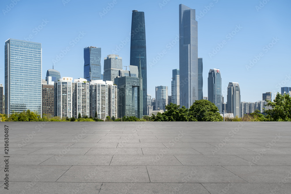 Urban skyscrapers with empty square floor tiles