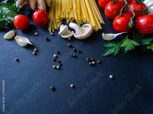 Ingredients for cooking paste on dark background top view.