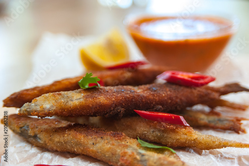 Roasted capelins with lemon and dip sauce  photo