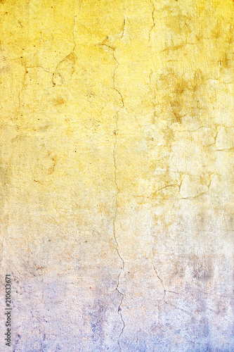 Old stucco wall texture of yellow and blue colors