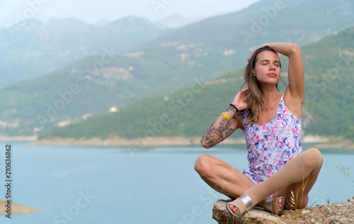 A girl with a tattoo on her arm is enjoying a holiday in Turkey