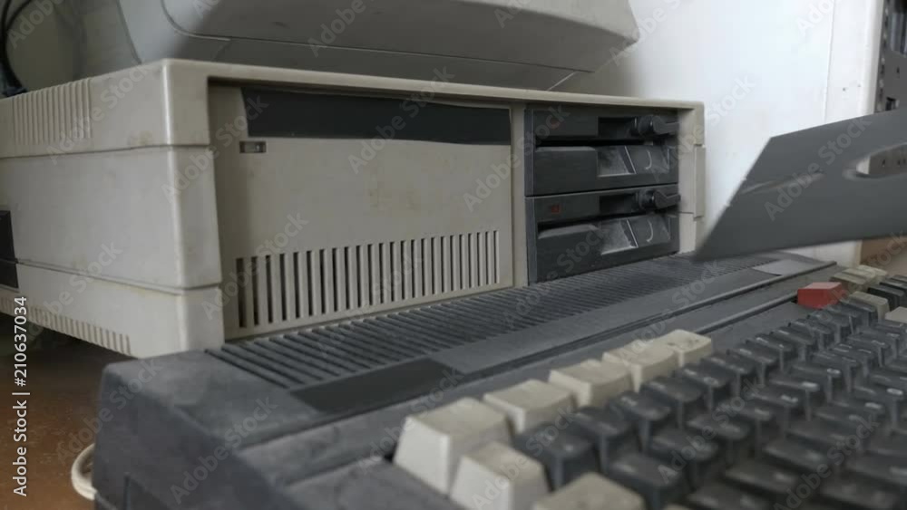 Removing a floppy disk from old personal computer Stock Video