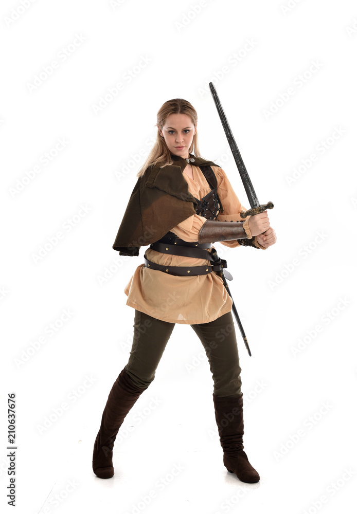 full length portrait of girl wearing brown medieval costume,. standing pose, isolated on white studio background. full length portrait of girl wearing brown medieval costume,. standing pose, isolated on white studio background.