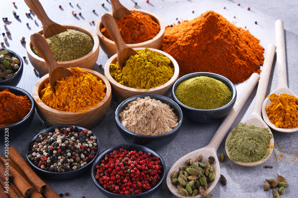 Variety of spices on kitchen table Variety of spices on kitchen table