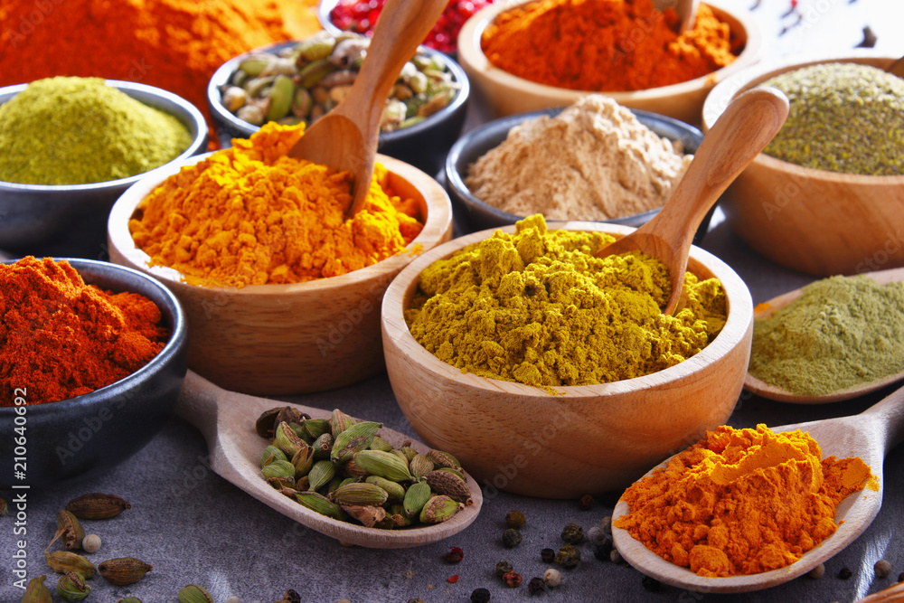 Variety of spices on kitchen table Variety of spices on kitchen table