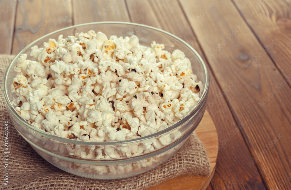 Salt popcorn on the wooden table Salt popcorn on the wooden table