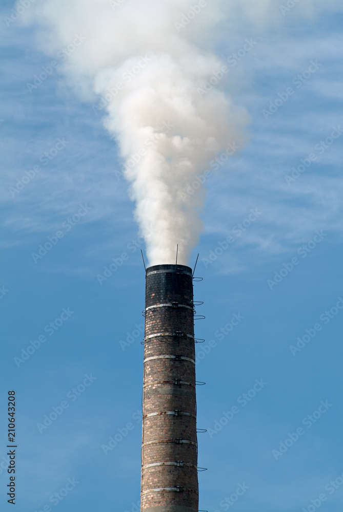 Factory Chimney Pumping Pollution Into the Atmosphere Factory Chimney Pumping Pollution Into the Atmosphere