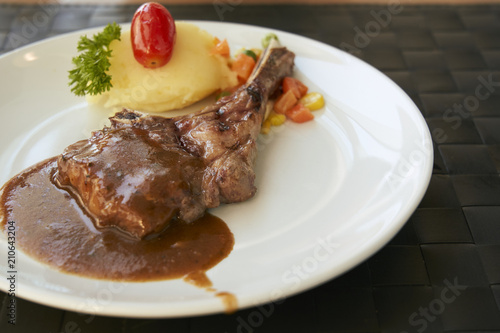 Roasted Lamb Chops on barbecue sauce with mash potato and salad.