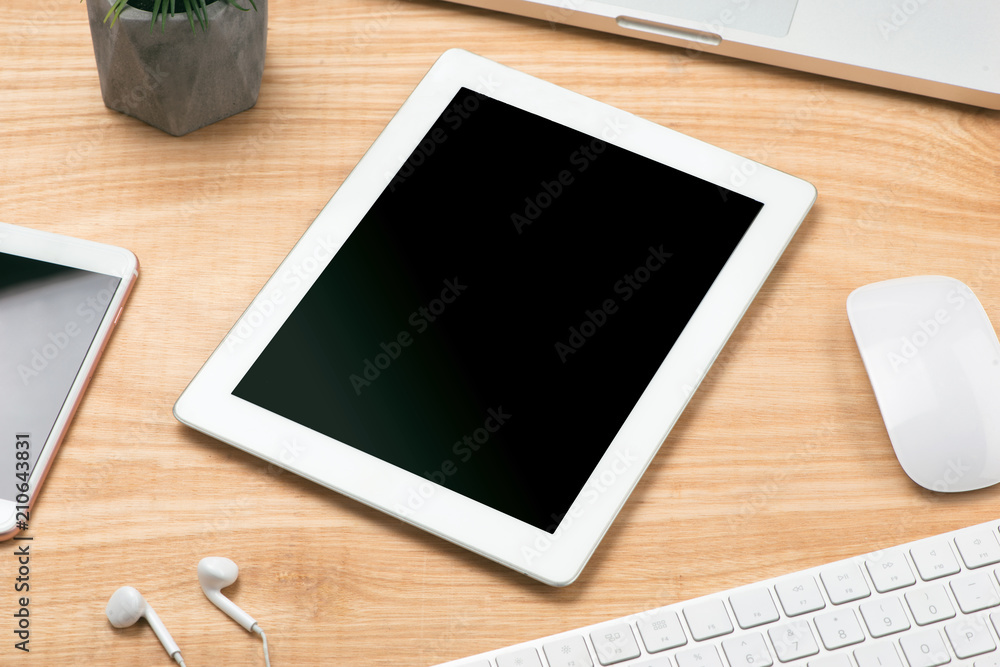 tablet touch pad computer gadget is in the office of a businessman on the table tablet touch pad computer gadget is in the office of a businessman on the table