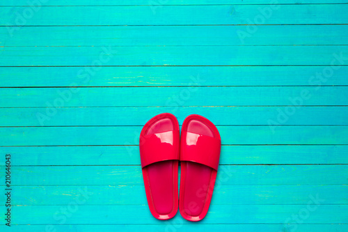flip-flops on color wooden background