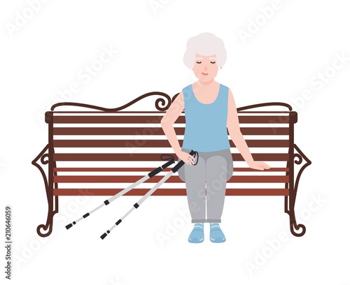 Happy old women dressed in sports clothing sitting on bench with poles for nordic walking