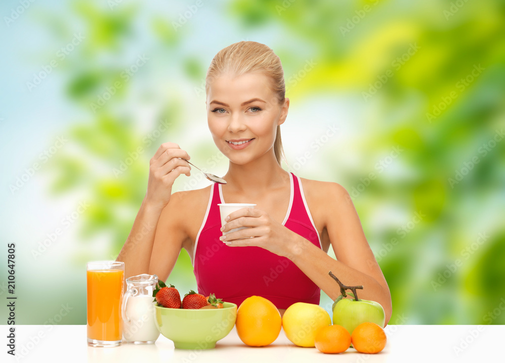 diet, healthy food and people concept - woman with fruits eating yogurt for breakfast over green natural background diet, healthy food and people concept - woman with fruits eating yogurt for breakfast over green natural background
