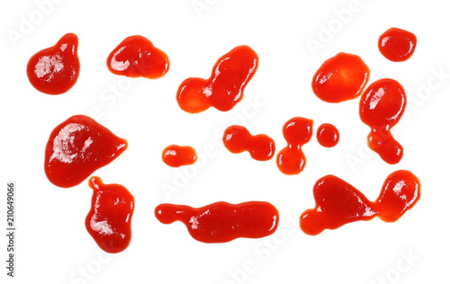 Red ketchup spreading, splashes, stains set isolated on white background, tomato pure texture, top view