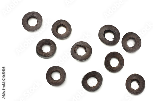 Marinated slices black olives isolated on white background. top view photo