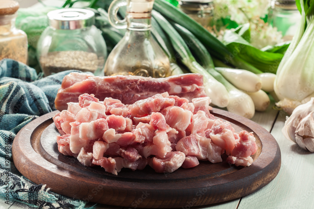 Raw pork belly pieces on a cutting board Raw pork belly pieces on a cutting board