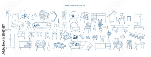 Collection of elegant modern furniture and home interior decorations of trendy Scandinavian or hygge style hand drawn with blue contour lines on white background. Monochrome vector illustration. photo