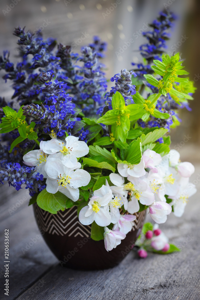 Bouquet of spring flowers on an old wooden background Bouquet of spring flowers on an old wooden background