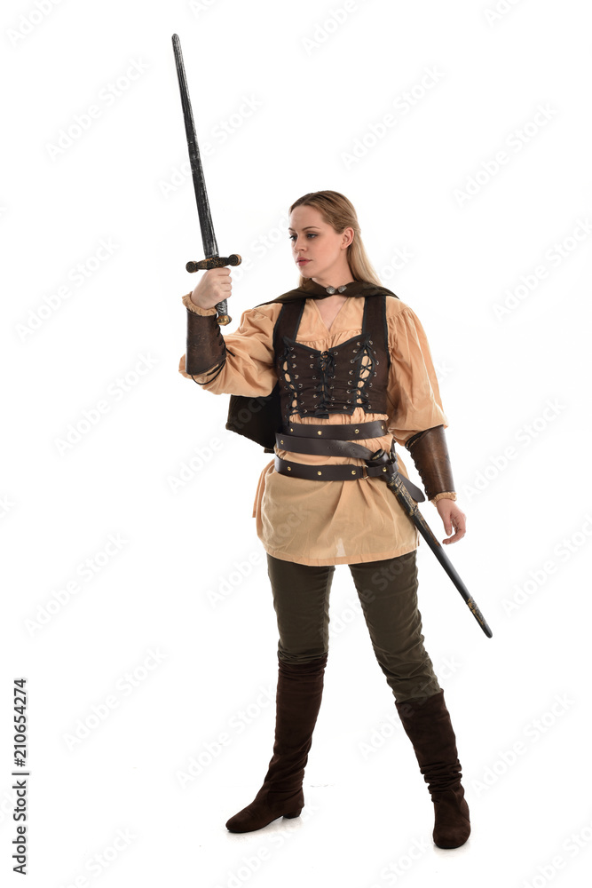 full length portrait of girl wearing brown medieval costume,. standing pose, isolated on white studio background. full length portrait of girl wearing brown medieval costume,. standing pose, isolated on white studio background.