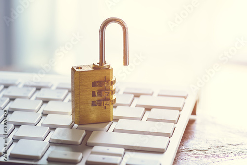 metal security lock with pass-code or password on computer keyboard