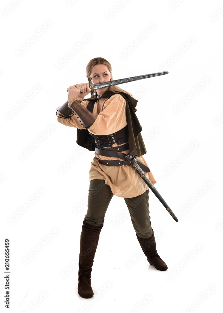 full length portrait of girl wearing brown medieval costume,. standing pose, isolated on white studio background. full length portrait of girl wearing brown medieval costume,. standing pose, isolated on white studio background.
