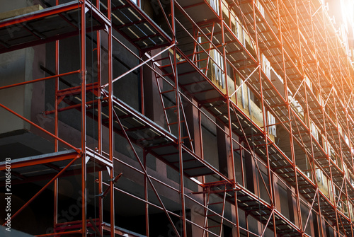 Fototapeta Building Construction With Scaffolding. Works at height
