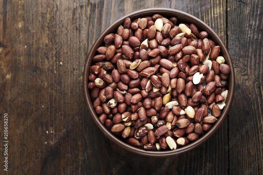 Fototapeta premium peanuts in a clay plate