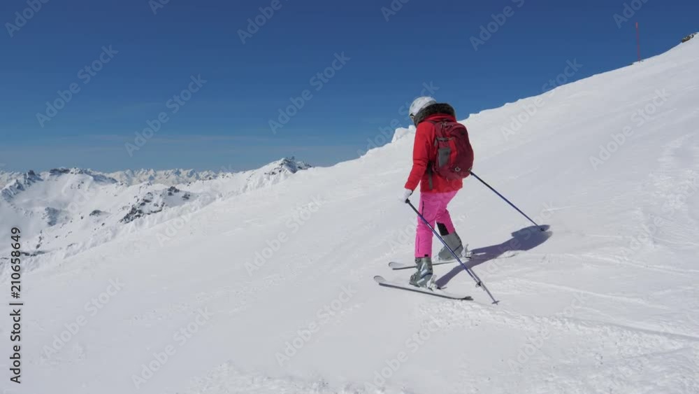 In Motion Woman Skier Skiing Down The Steep Slope Of The Mountain Resort In Motion Woman Skier Skiing Down The Steep Slope Of The Mountain Resort
