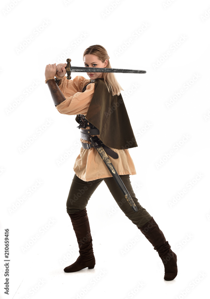full length portrait of girl wearing brown medieval costume,. standing pose, isolated on white studio background. full length portrait of girl wearing brown medieval costume,. standing pose, isolated on white studio background.