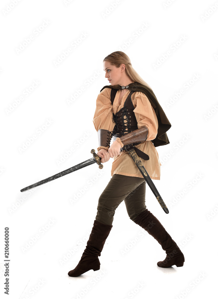 full length portrait of girl wearing brown medieval costume,. standing pose, isolated on white studio background. full length portrait of girl wearing brown medieval costume,. standing pose, isolated on white studio background.