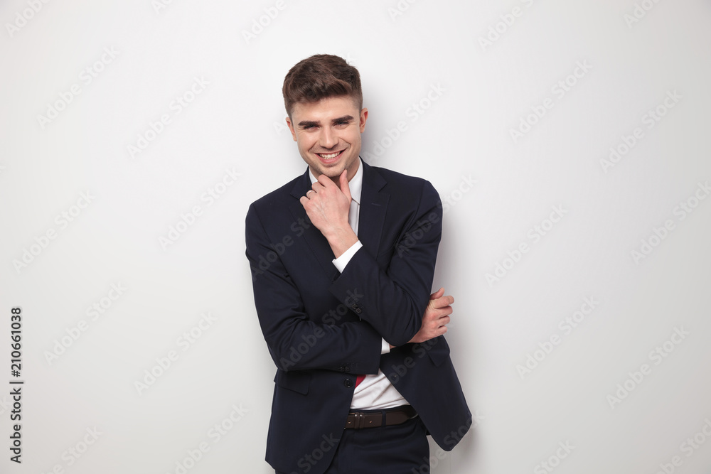 portrait of smiling pensive businessman in navy suit standing portrait of smiling pensive businessman in navy suit standing