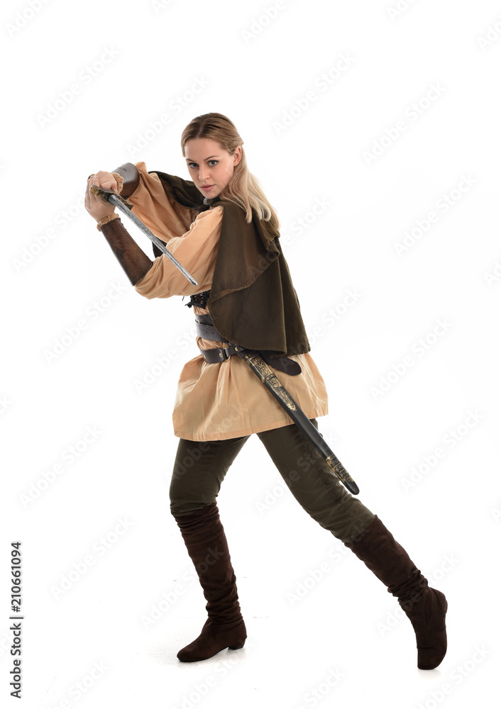 full length portrait of girl wearing brown medieval costume,. standing pose, isolated on white studio background. full length portrait of girl wearing brown medieval costume,. standing pose, isolated on white studio background.