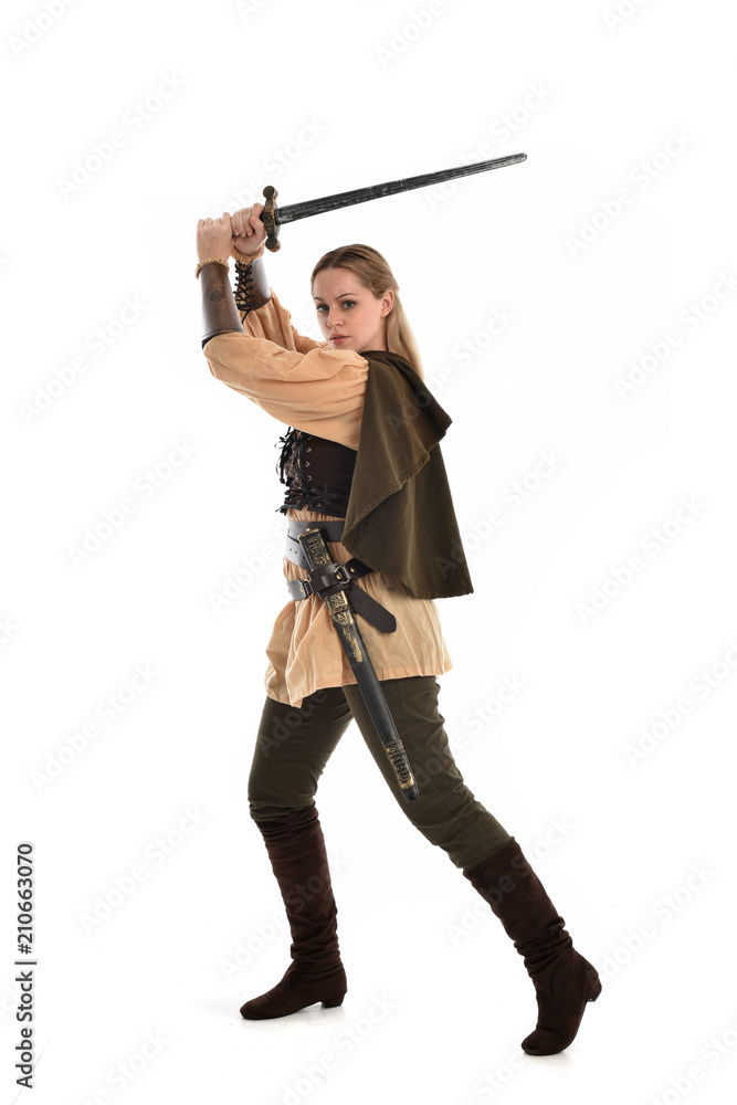 full length portrait of girl wearing brown medieval costume,. standing pose, isolated on white studio background. full length portrait of girl wearing brown medieval costume,. standing pose, isolated on white studio background.