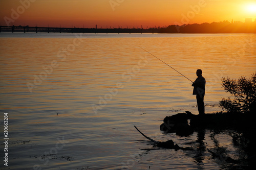 Silhouette of fisherman