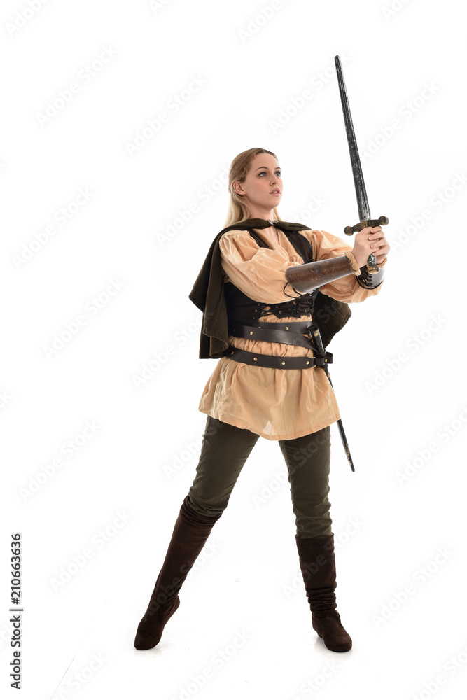 full length portrait of girl wearing brown medieval costume,. standing pose, isolated on white studio background. full length portrait of girl wearing brown medieval costume,. standing pose, isolated on white studio background.