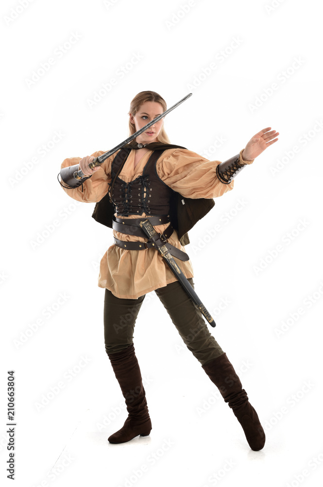 full length portrait of girl wearing brown medieval costume,. standing pose, isolated on white studio background. full length portrait of girl wearing brown medieval costume,. standing pose, isolated on white studio background.