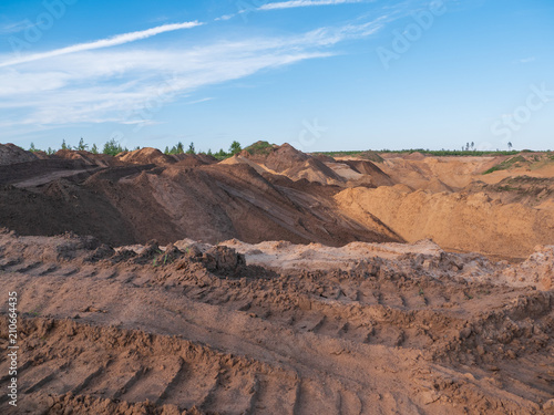 Industrial sand quarry or pit landscape. Construction industry. Sand hills background