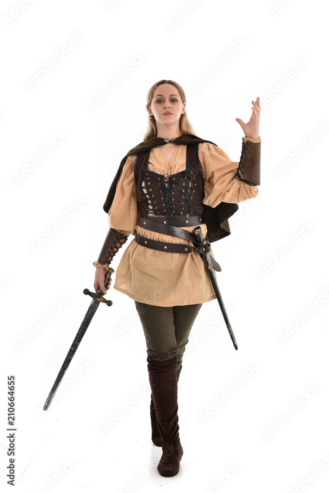 full length portrait of girl wearing brown medieval costume,. standing pose, isolated on white studio background. full length portrait of girl wearing brown medieval costume,. standing pose, isolated on white studio background.