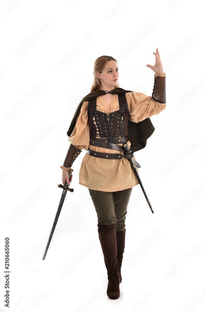 full length portrait of girl wearing brown medieval costume,. standing pose, isolated on white studio background. full length portrait of girl wearing brown medieval costume,. standing pose, isolated on white studio background.