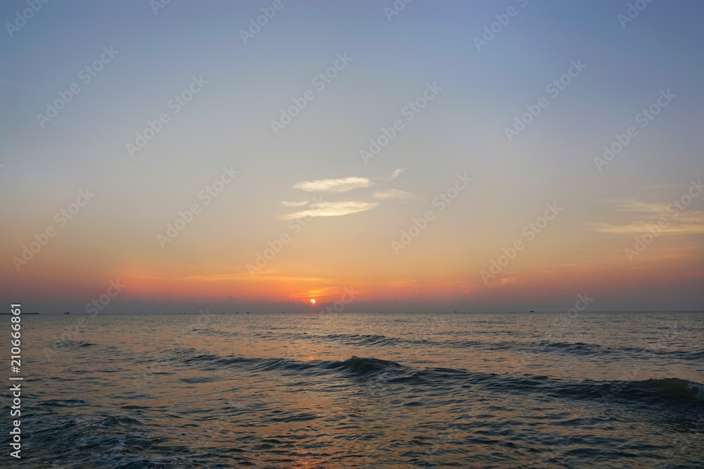 Obraz premium Morning on sea, Beautiful nature blue sky with clouds. Colorful sky as a background. Soft wave of the sea on the sandy beach at Cha-am beach, Thailand. Space for text in template. Travel concept.