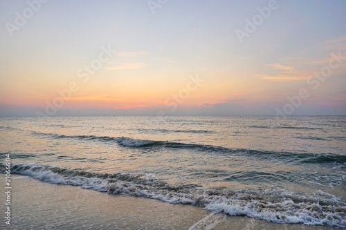 Morning on sea  Beautiful nature blue sky with clouds. Colorful sky as a background. Soft wave of the sea on the sandy beach at  Cha-am beach  Thailand. Space for text in template. Travel concept.
